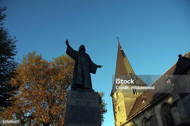 Church With Monument In The Vilagecenter Stock Photo - Download Image Now - Building Exterior, Built Structure, Catholicism