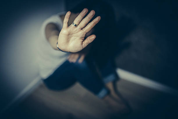 Stop violence over women An abused woman trying to defend herself harassment stock pictures, royalty-free photos & images