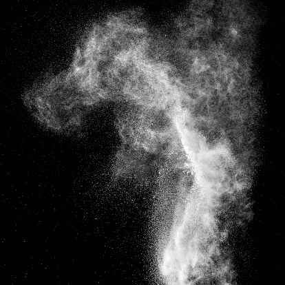 Flour explosion on black background