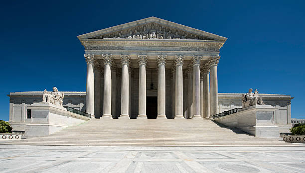 United States Supreme Court Full Frontal View Nobody United States Supreme Court full frontal view, brilliant blue sky, No People supreme court stock pictures, royalty-free photos & images
