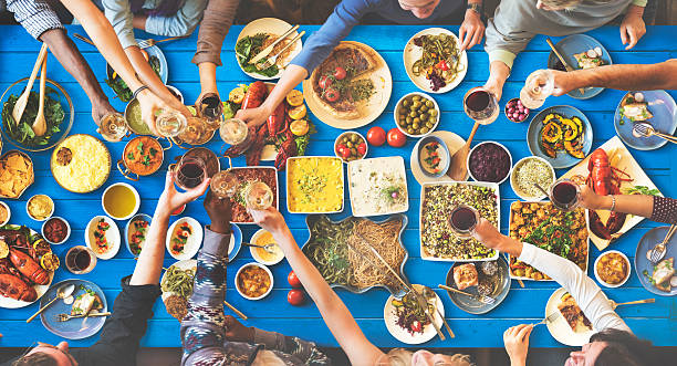 istock Friends Happiness Enjoying Dinning Eating Concept 523697306