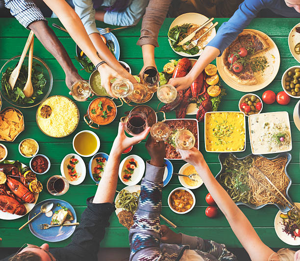 istock Friends Happiness Enjoying Dinning Eating Concept 523697360