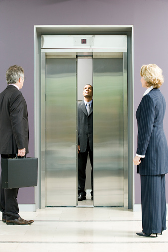Administrative workers waiting for elevator