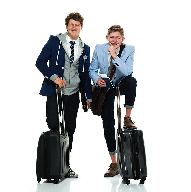 istock Happy men standing with trolley bag 523698512
