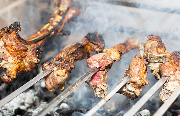 istock Grilling shashlik on barbecue grill. 523701412
