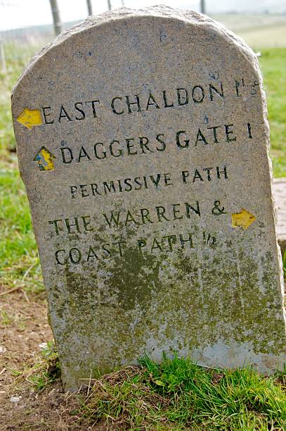 istock Stone sign on Jurassic Coast, Dorset 523701770