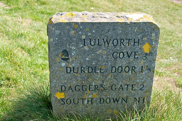 istock Stone sign on Jurassic Coast, Dorset 523701942