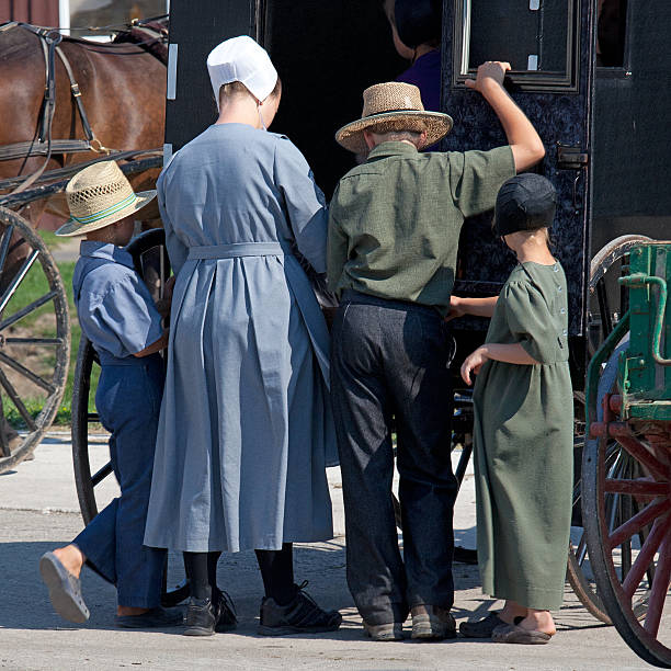 Amish Family Kidron, OH, USA - August 23, 2012: Amish family at the county auction amish photos stock pictures, royalty-free photos & images