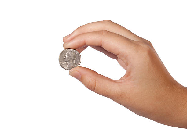 istock US coin between the fingers 523706797