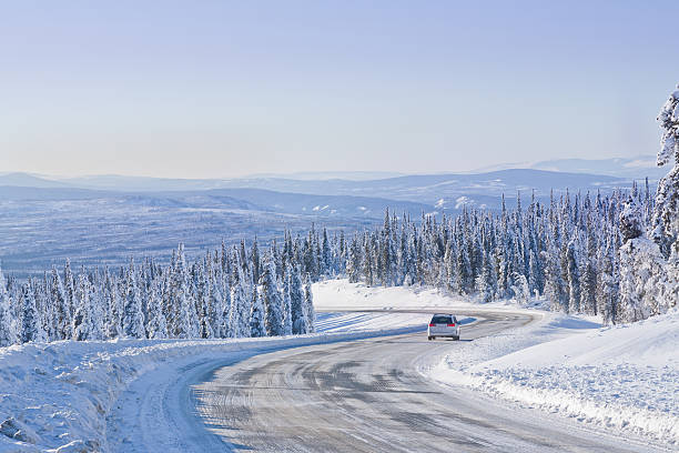 istock Car Driving on a Remote Winter Highway 523707189