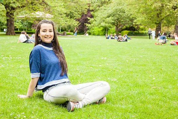 Photo of Woman sitting on the grass