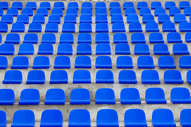 istock plastic blue seats on football stadium 523708703