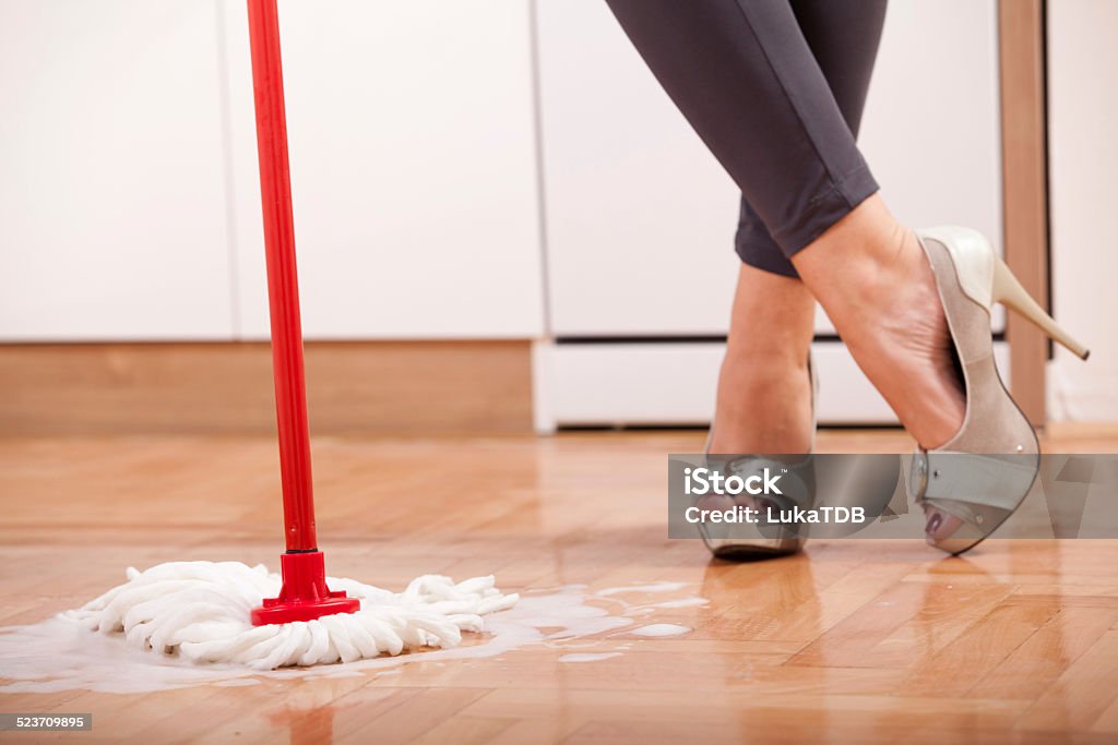 House cleaning Young woman cleaning and doing housework Adult Stock Photo