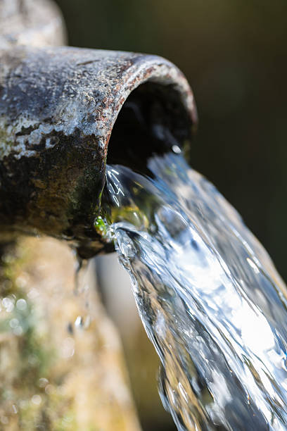 istock Spout of an old water pump 523711343