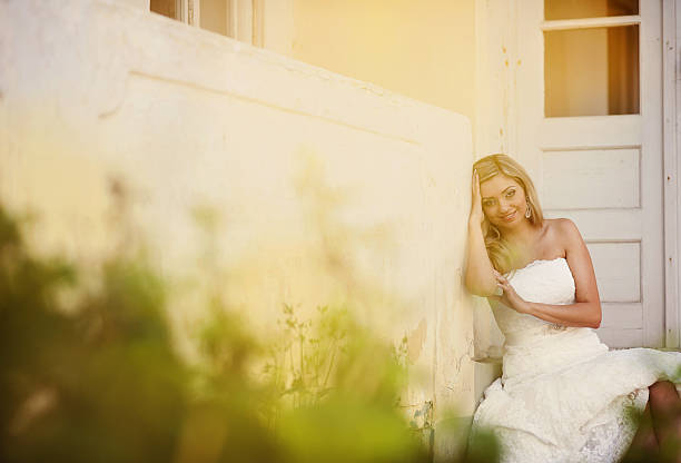 istock Blonde bride by old house 523720791