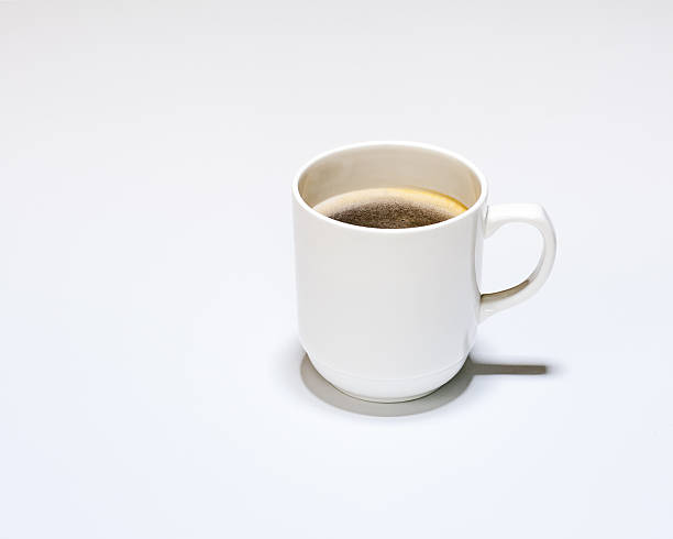 istock White Cup of Hot Coffee on Gray Background. 523721199