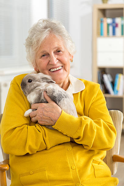 Senior woman with a little rabbit