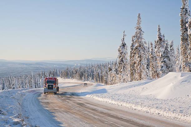 istock Truck Driving on a Icy Winter Highway 523722487