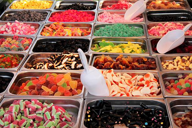street food: candies of all tastes candies of all tastes and colors displayed in a stall pick and mix stock pictures, royalty-free photos & images