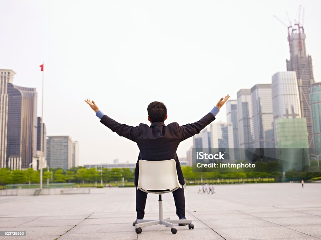 asian businessman asian businessman opens arms embracing the city. Japanese Ethnicity Stock Photo