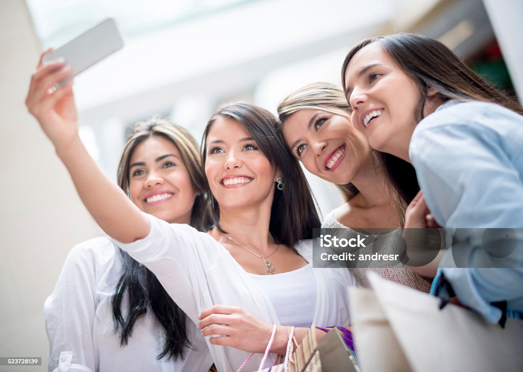 Selfie shopping Women taking a selfie while shopping at the mall 20-29 Years Stock Photo
