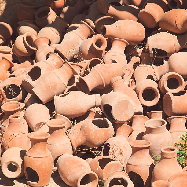 istock Heap of old ceramic pots in retro style 523728185