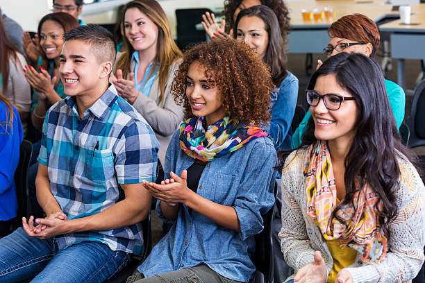 istock Diverse students applauding lecturer or professor during college class 523734011