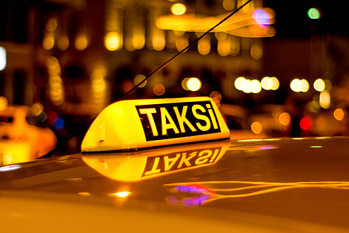 Close up of yellow taxi on street of Istanbul, Turkey.