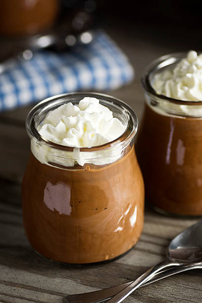 istock Chocolate Pudding with Whipped Cream in Glass Jars 523734927
