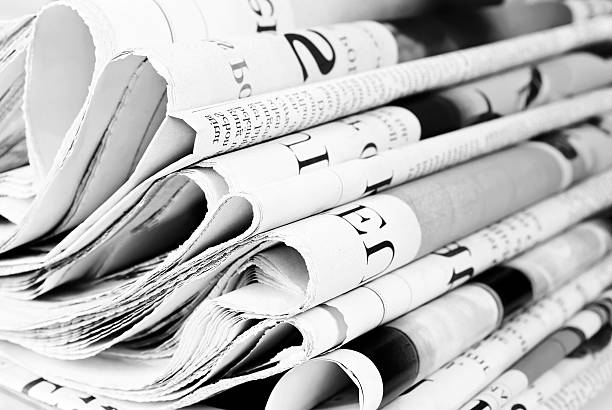 Pile of old newspapers Pile of old newspapers, selective focus newspaper headline photos stock pictures, royalty-free photos & images