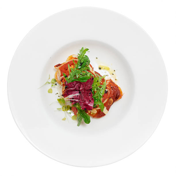 istock Fish and potatoes fried with romesco sauce 523740283