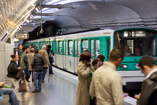 Paris, France - April 27, 2013:Travellers on Parisian Metro station (name:Mirabeau) in Paris. Paris Metro is the 2nd largest underground system worldwide by number of stations (300).