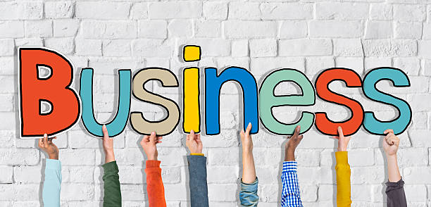 istock Multiethnic Group of Hands Holding Word Business 523741065