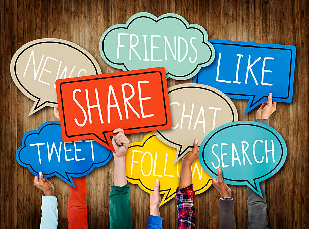 istock Hands Holding Speech Bubbles with Social Media Words 523741467