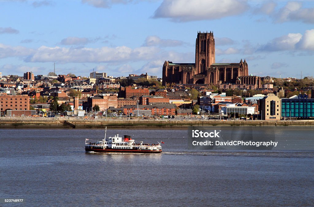 Liverpool Anglican Cathedral View across The River Mersey of the majestic Liverpool Anglican Cathedral with the iconic Mersey Ferry in the foreground Anglican Cathedral - Liverpool Stock Photo