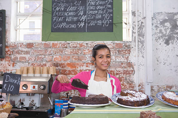 istock Girl Displaying Pastry In Shop 523751577