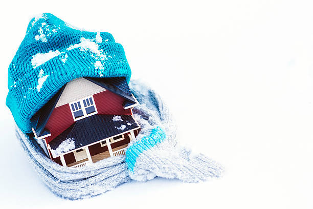 House Wrapped in Winter Clothing; Insulate Your Home House Wrapped in Winter Clothing; Insulate Your Home winterizing stock pictures, royalty-free photos & images