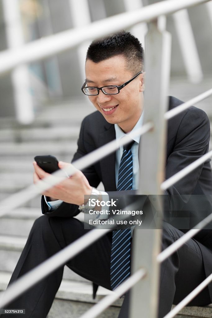 Social Media Life Young businessman using mobile phone Adult Stock Photo