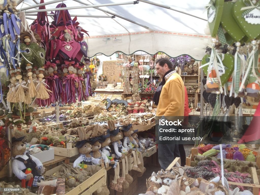 European Farmer Markets Munich Viktualienmarkt. Green market in Munich. On this image a customer in a market stall selling Easter related products Bavaria Stock Photo
