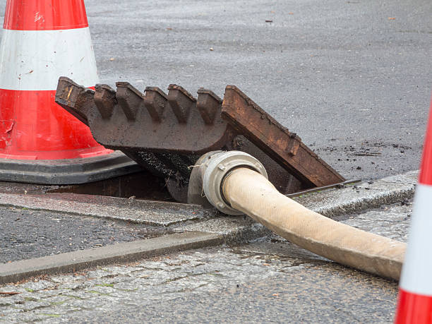 istock Gully cover with fire hose and Pylon 523760524