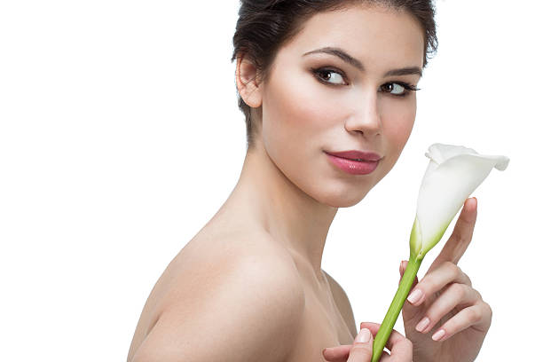istock woman with calla flower 523763108