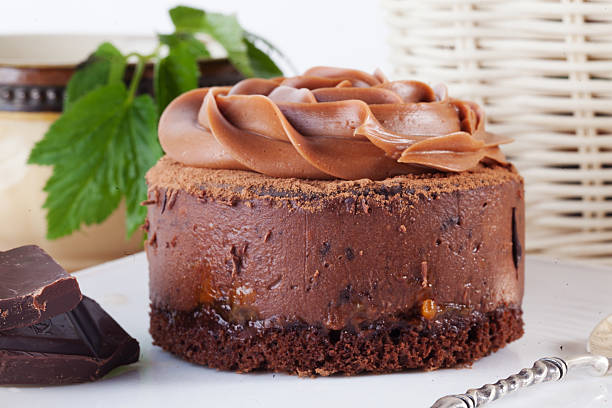 istock Rose chocolate mousse cake on a beautiful plate cream 523764750