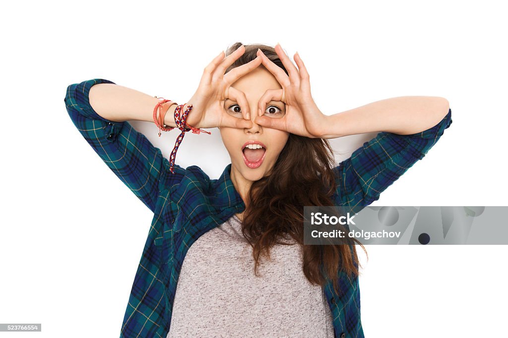 happy teenage girl making face and having fun people and teens concept - happy smiling pretty teenage girl making face and having fun Making A Face Stock Photo