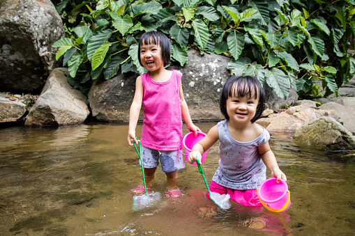 Asian Little Chinese Girls Playing in Creek in the Forest