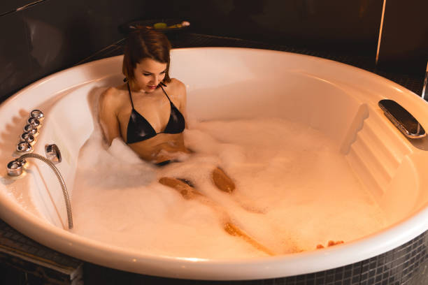 istock Young woman enjoying in bubble bath. 523769230