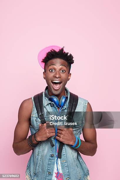Summer Portrait Of Excited Afro American Guy Stock Photo - Download Image Now - Colored Background, Men, African Ethnicity