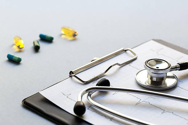istock empty doctor workplace with a stethoscope and pills 523771758