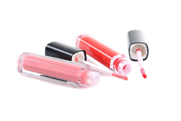 istock Pink and red lip gloss isolated on a white 523773576
