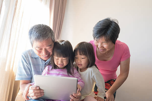 istock Happy family with tablet pc 523774156