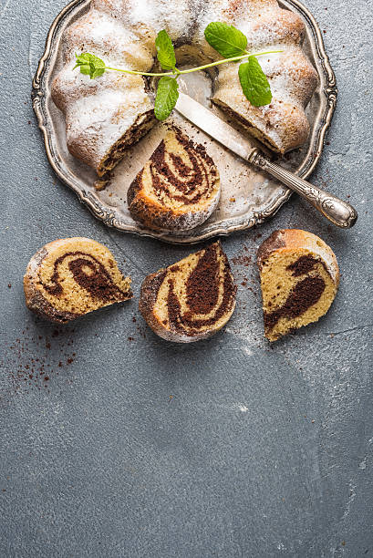 istock Zebra bundt cake cut into pieces and mint leaves 523776080
